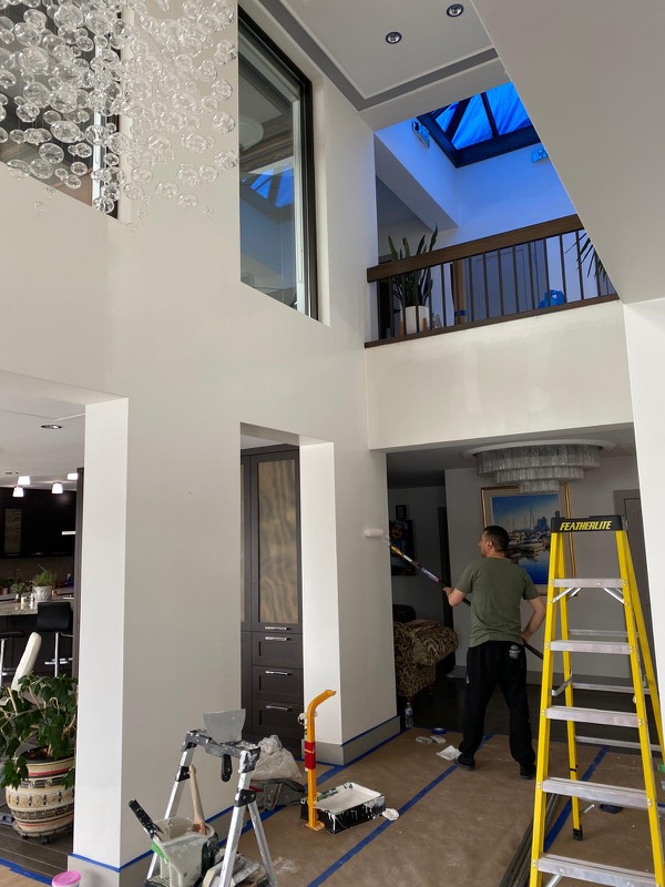 Crew working in a bright two-storey atrium