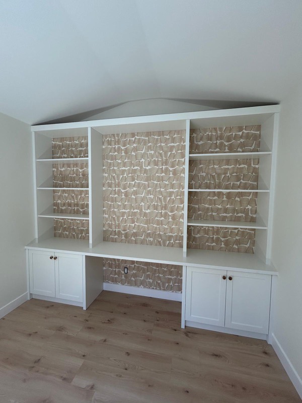 Built-in shelving and desk unit with crisp trim