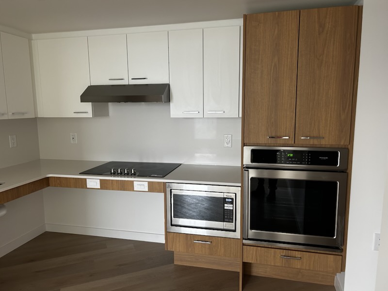 Accessible suite kitchen with lowered counter and wall oven