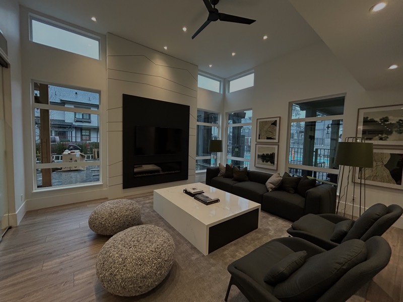 Finished open-plan living room with a feature fireplace wall