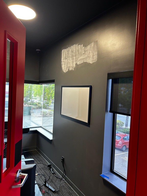 Repaired and painted practice room with acoustic panels